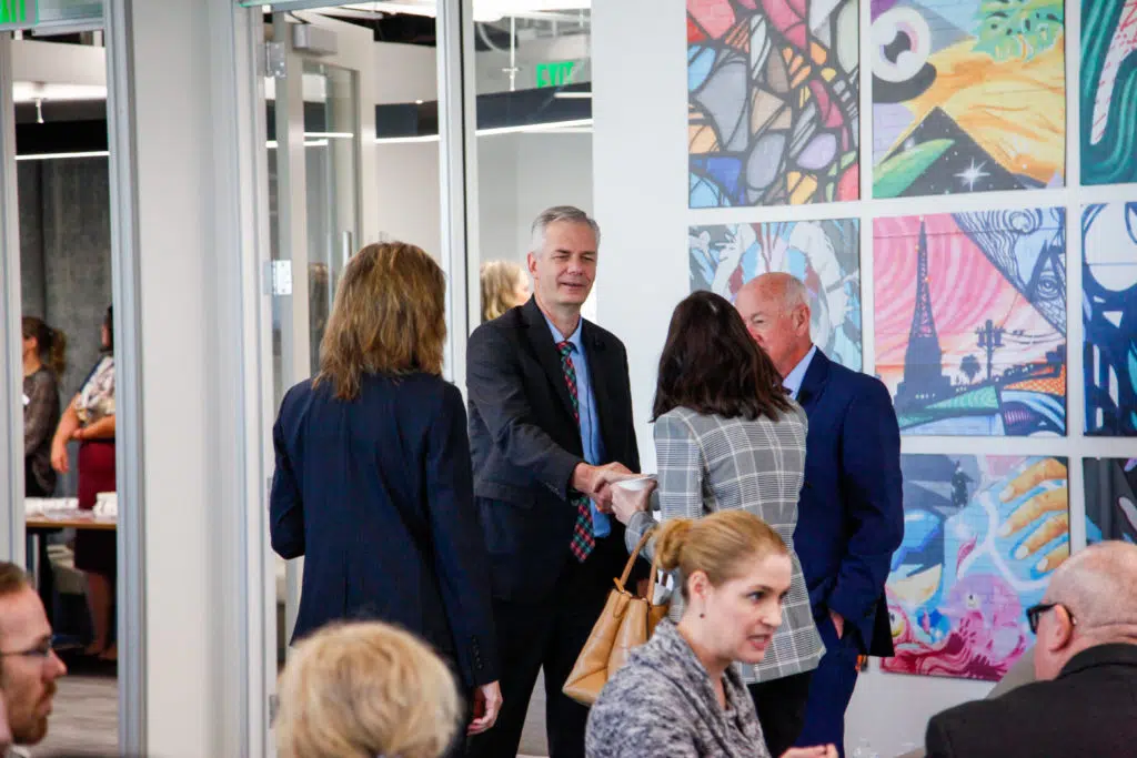 Business executives in conversation with a handshake